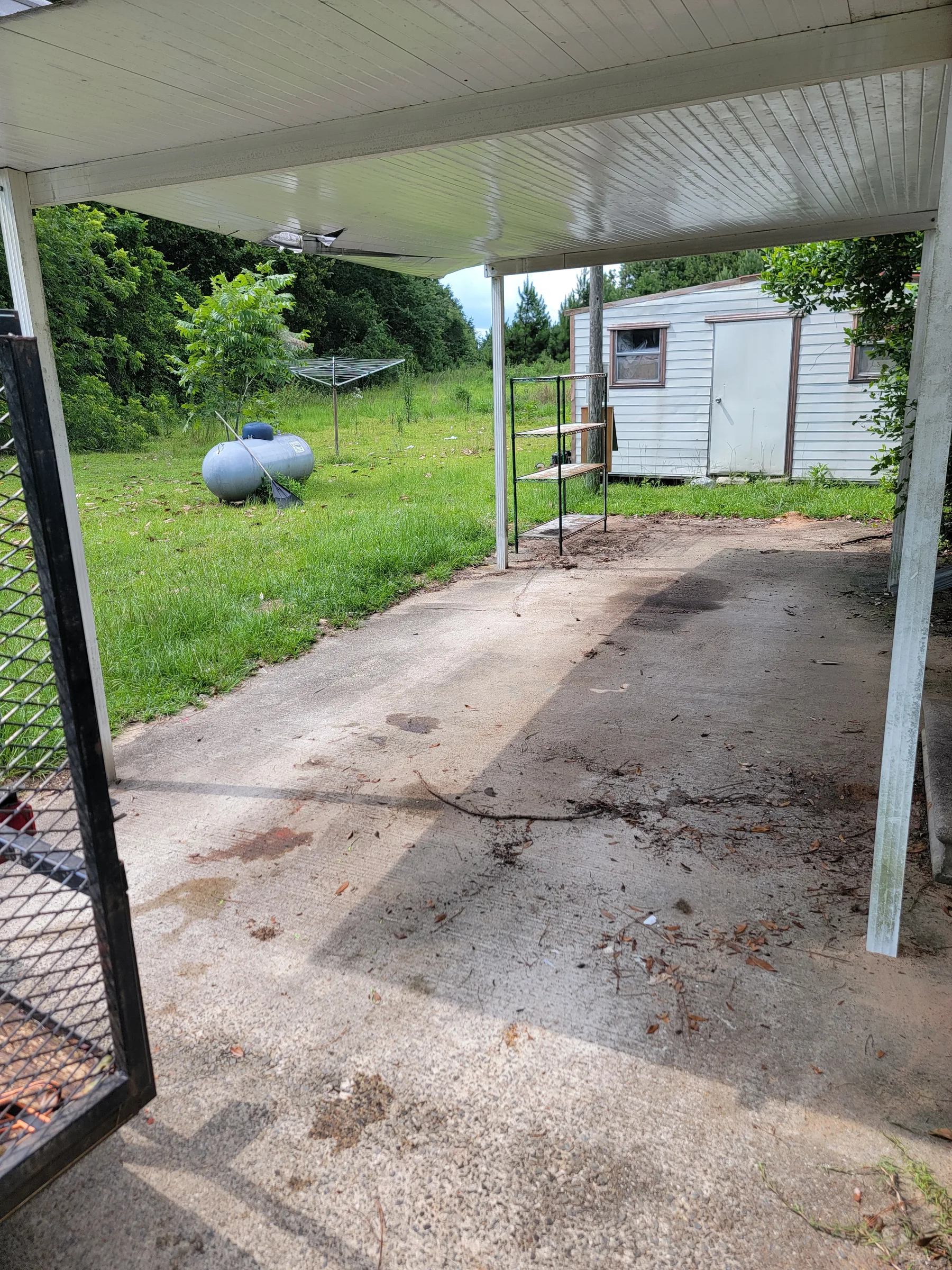 The same carport after the trash and unwanted items were removed
